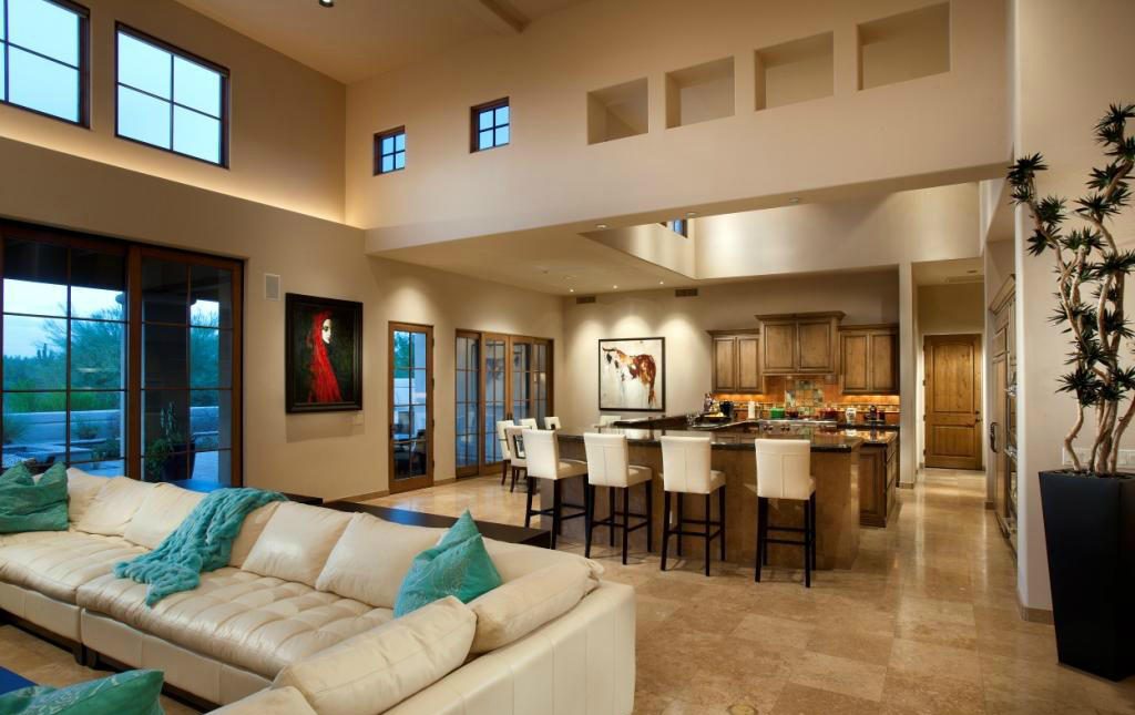 The great room before renovation — dated tan walls and dark, traditional finishes
