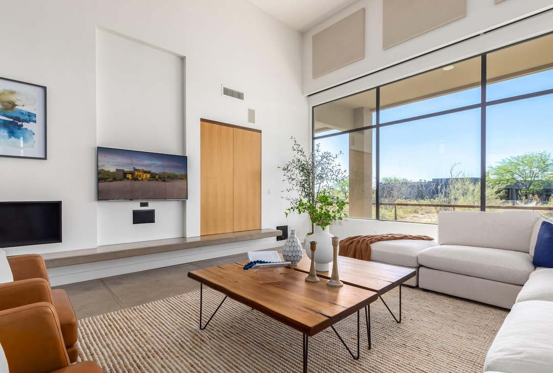 The great room before — drywall media wall with a recessed TV niche